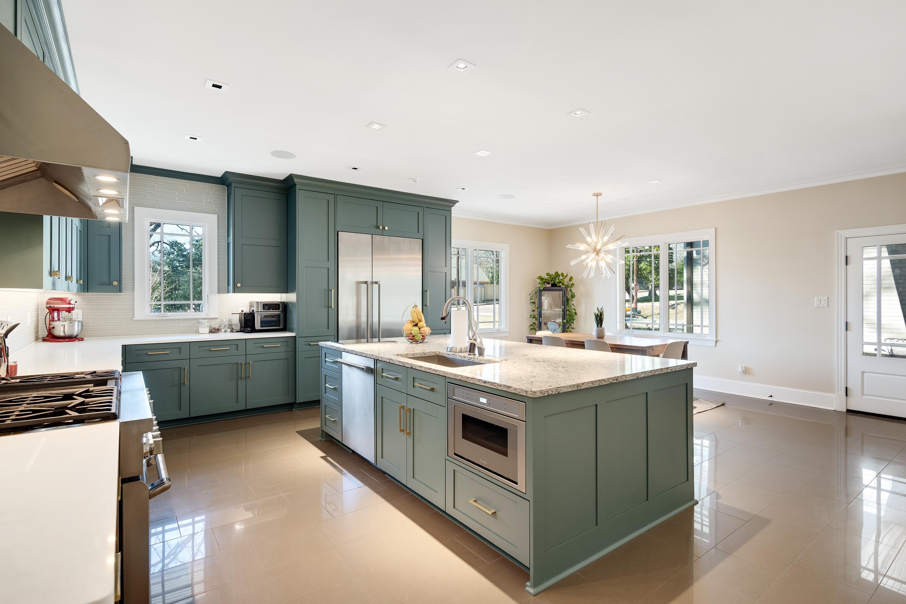 90 North Perkins Road Memphis, TN 38117 - Photo 6 of 25 a kitchen with stainless steel appliances granite countertop a lot of counter space and wooden floor