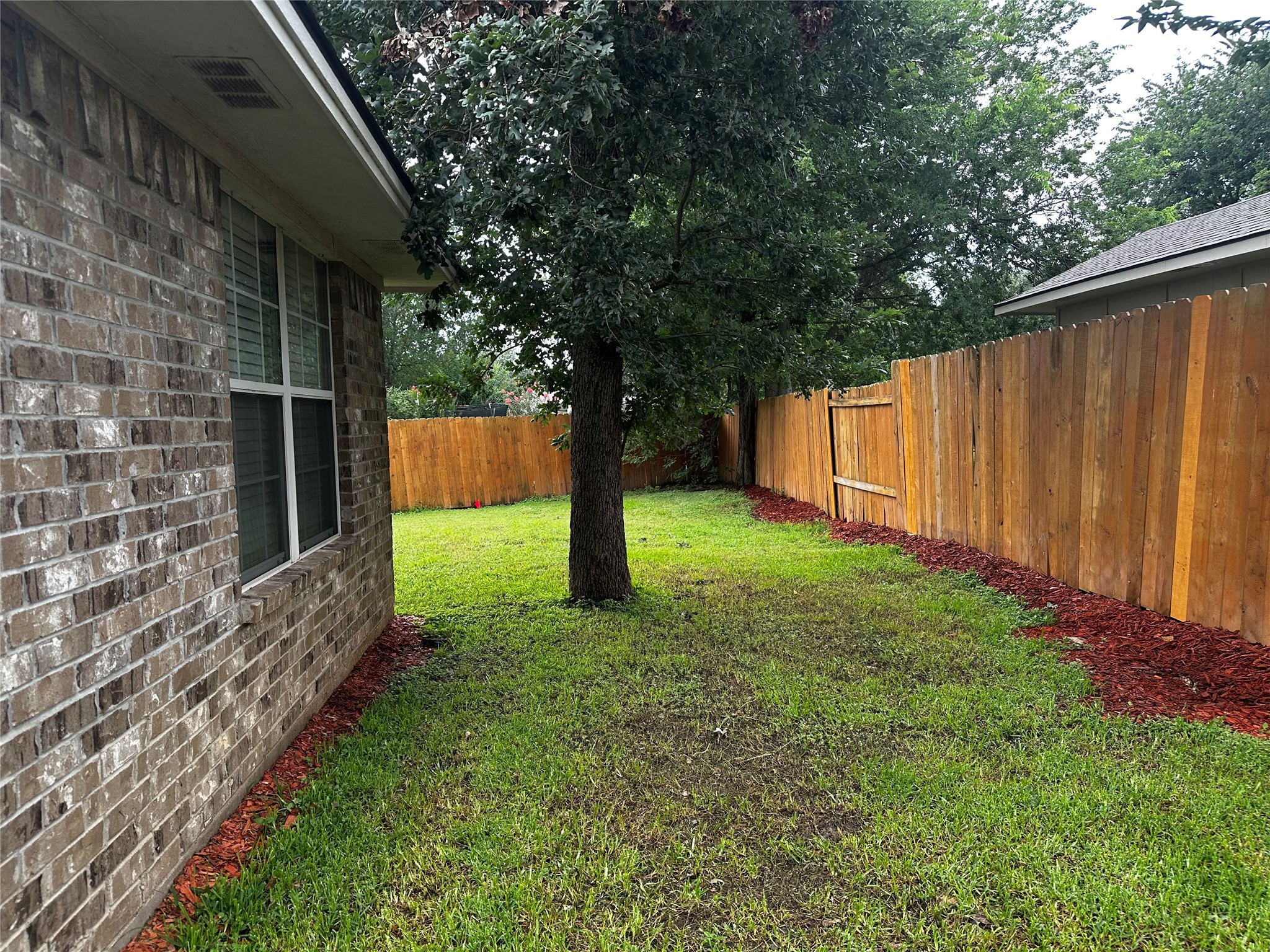 1400 Prairie Drive Bryan, TX 77802 - Photo 18 of 18 A generous backyard offers a private outdoor sanctuary, fully enclosed for enjoyment.