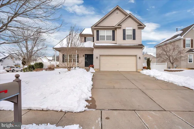 a view of white house with a yard