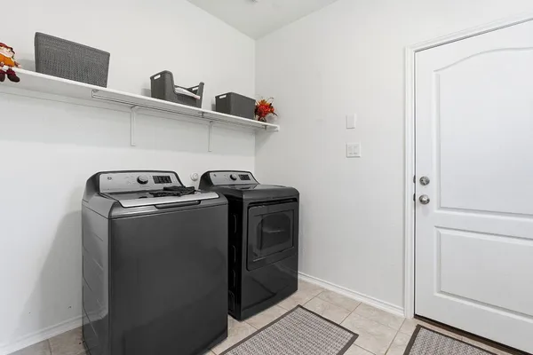 a utility room with dryer and washer