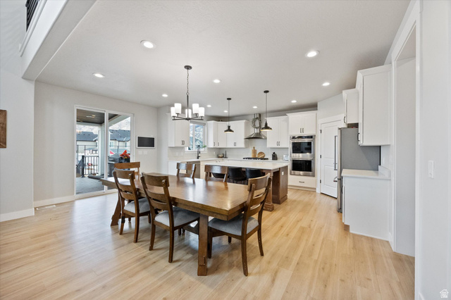 754 West 400 North, Unit 29 Mapleton, UT 84664 - Photo 6 of 25 Dining room featuring hanging lights and light wood finished floors