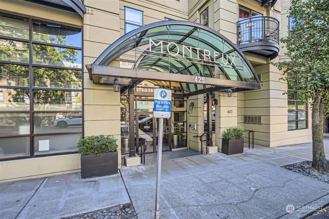 a view of a building with sitting area