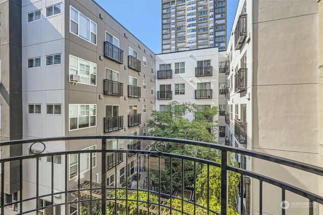 a view of a large building from a balcony