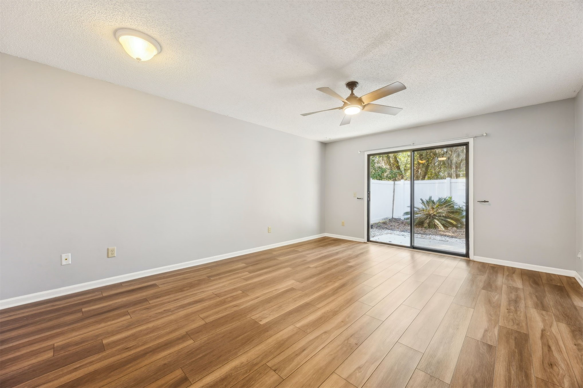 7 Jasmine Place Fernandina Beach, FL 32034 - Photo 17 of 27 wooden floor in an empty room with a window