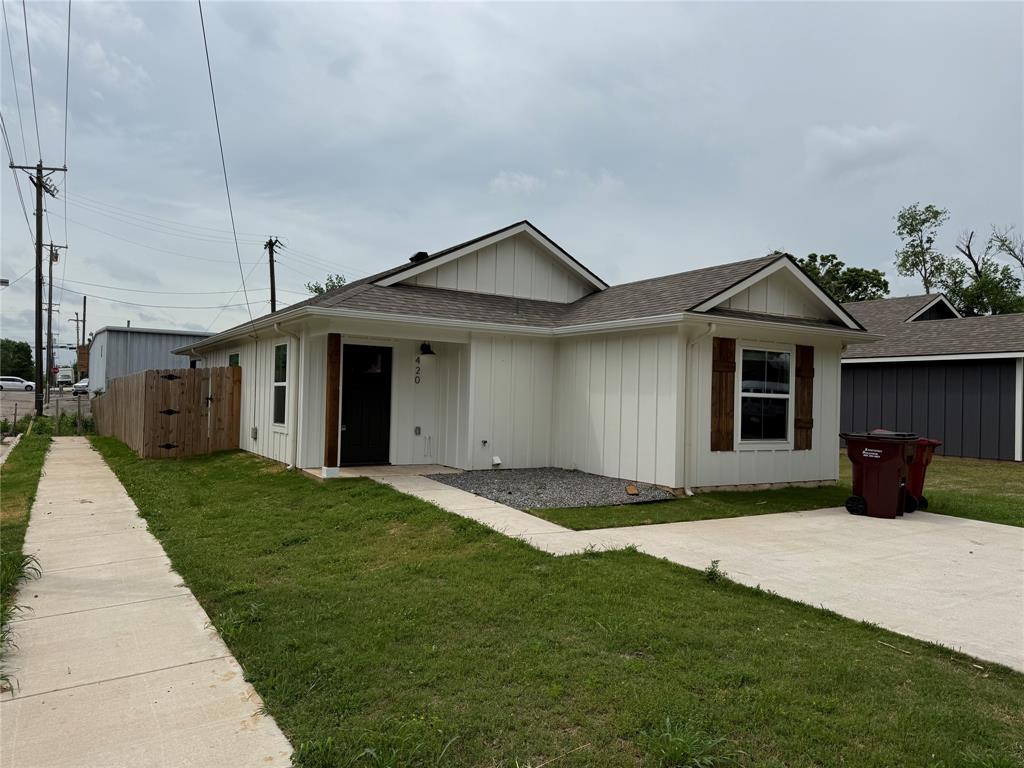 420 East 5th Street Bonham, TX 75418 - Photo 1 of 1 a front view of a house with a yard