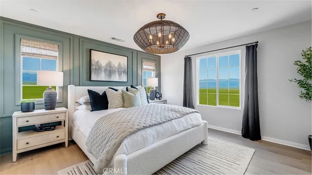 a bedroom with bed and a window