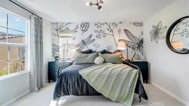 a bedroom with bed and a window