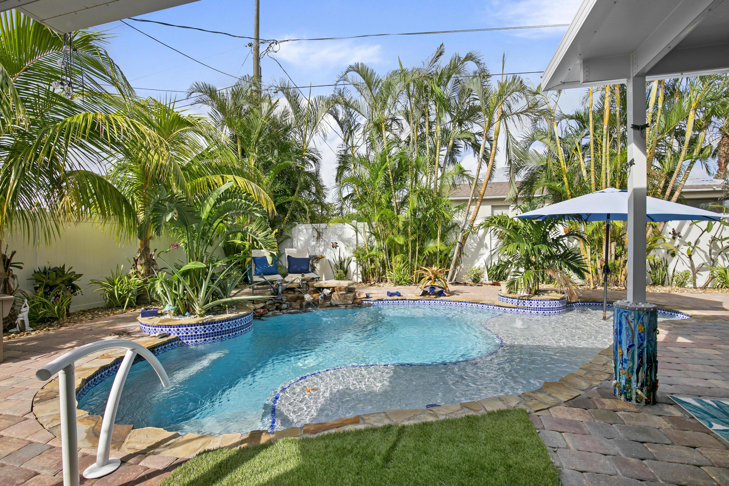 9025 Pomelo Road West Fort Myers, FL 33967 - Photo 1 of 27 a view of a swimming pool with a patio