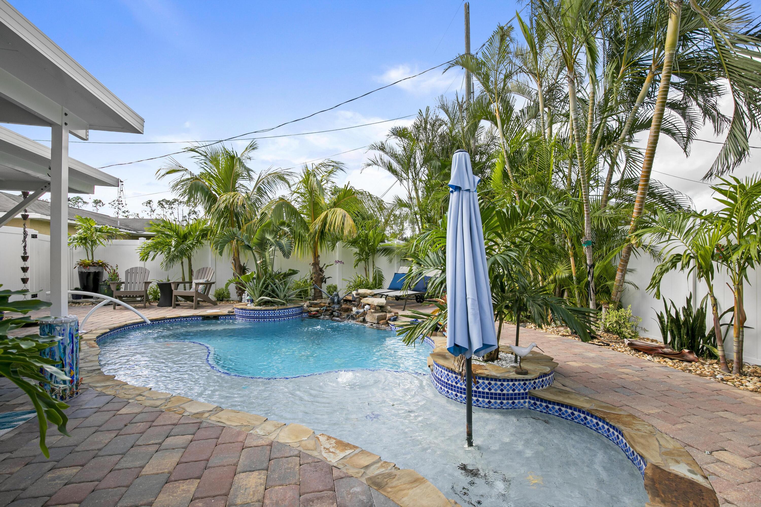 9025 Pomelo Road West Fort Myers, FL 33967 - Photo 17 of 27 a view of a backyard with swimming pool