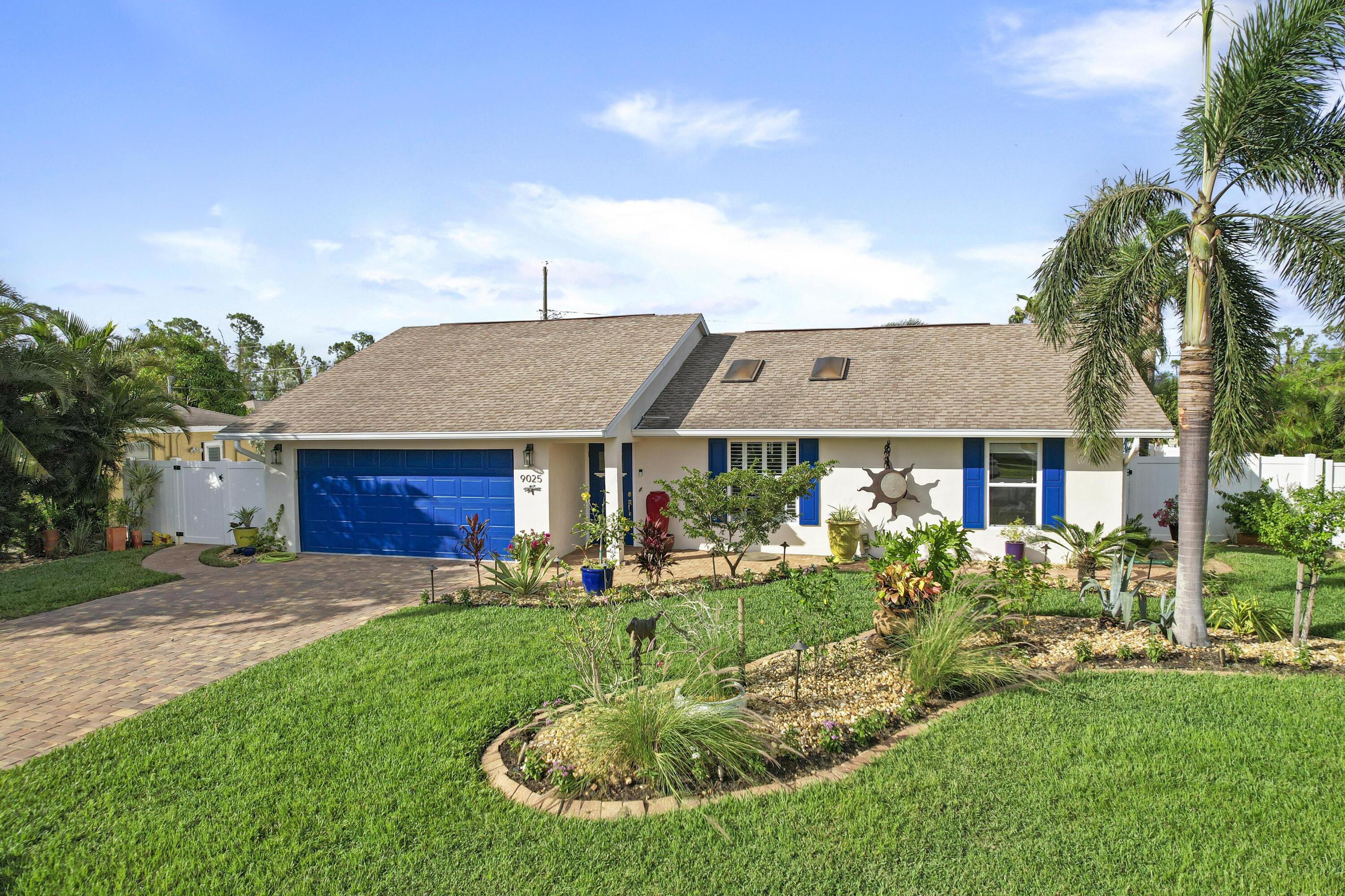 9025 Pomelo Road West Fort Myers, FL 33967 - Photo 23 of 27 a front view of a house with a yard table and chairs