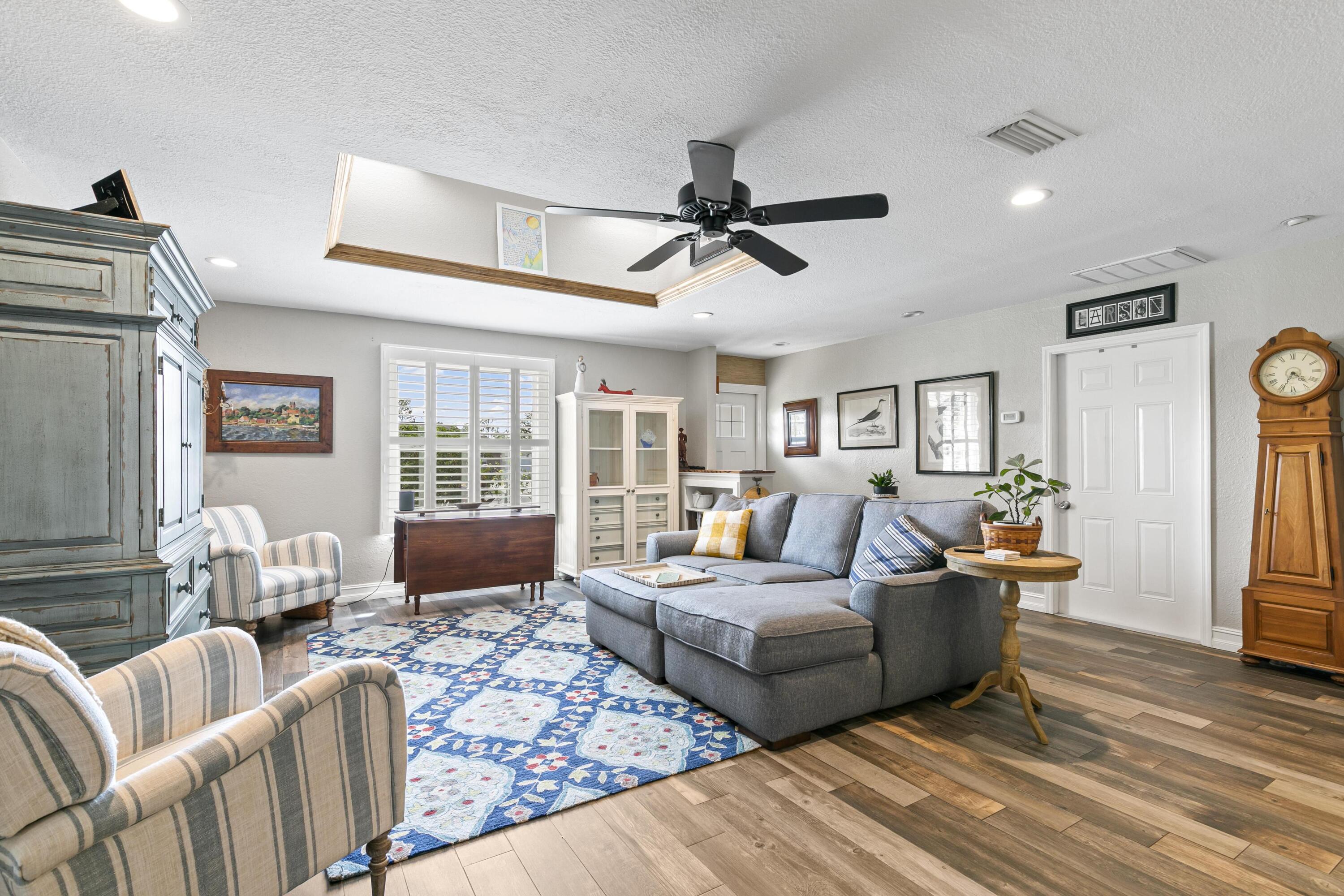 9025 Pomelo Road West Fort Myers, FL 33967 - Photo 3 of 27 a living room with furniture and a wooden floor
