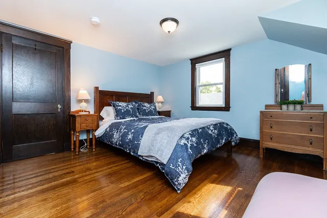 a bedroom with a bed and a dresser