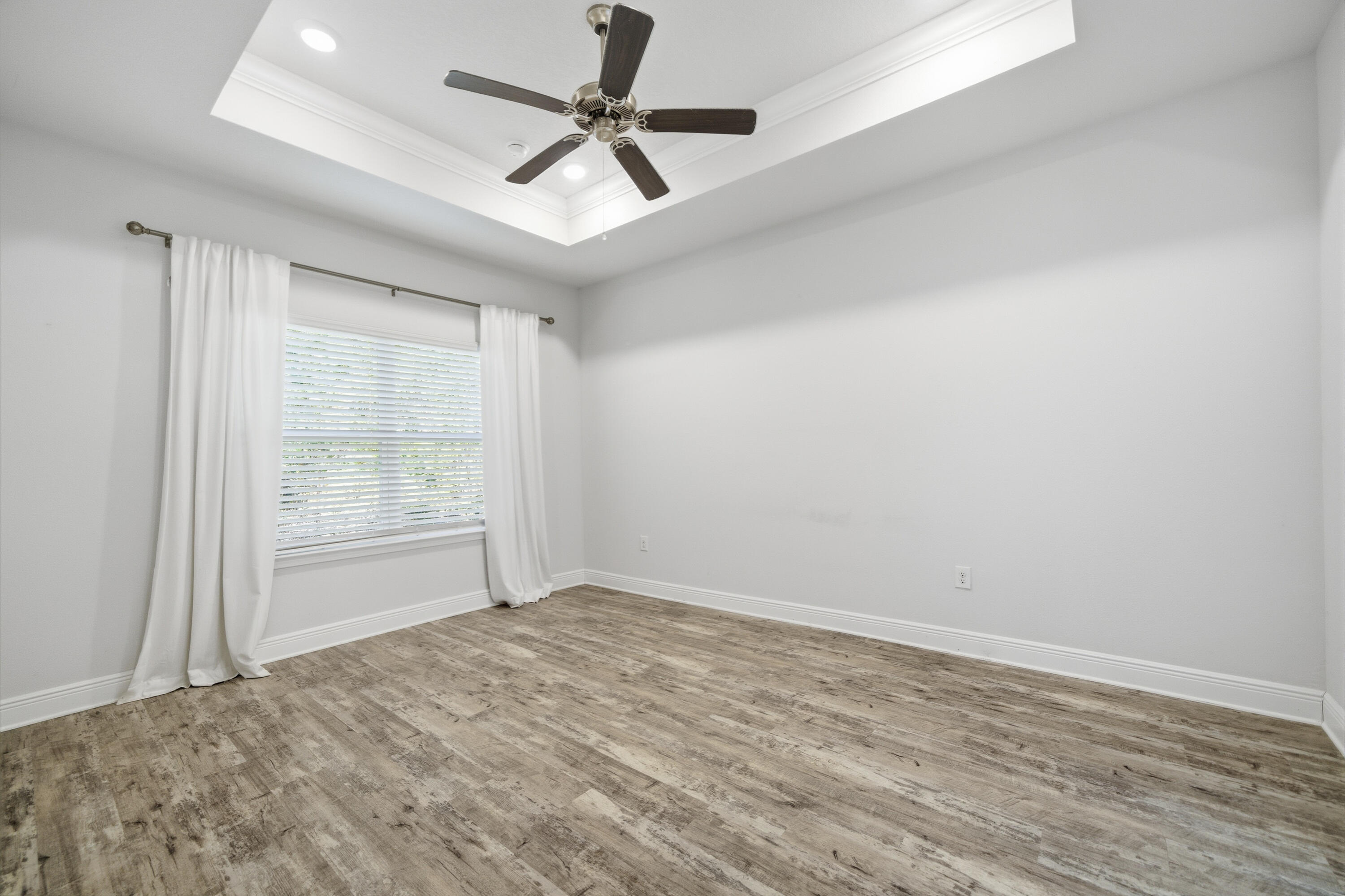 191 Southern Pnes Road Santa Rosa Beach, FL 32459 - Photo 18 of 46 wooden floor in an empty room with a window