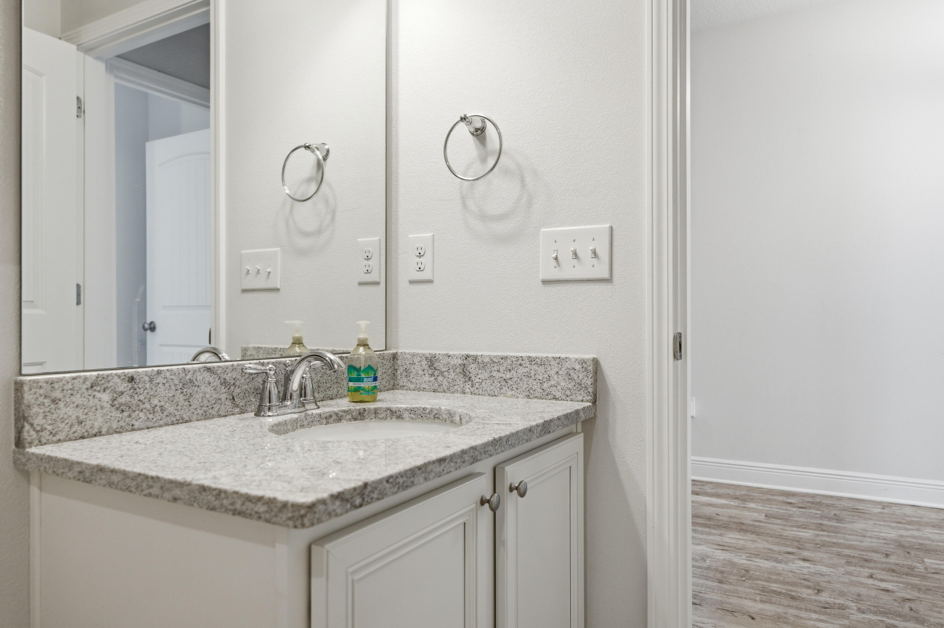 191 Southern Pnes Road Santa Rosa Beach, FL 32459 - Photo 36 of 46 a bathroom with a granite countertop sink and a mirror