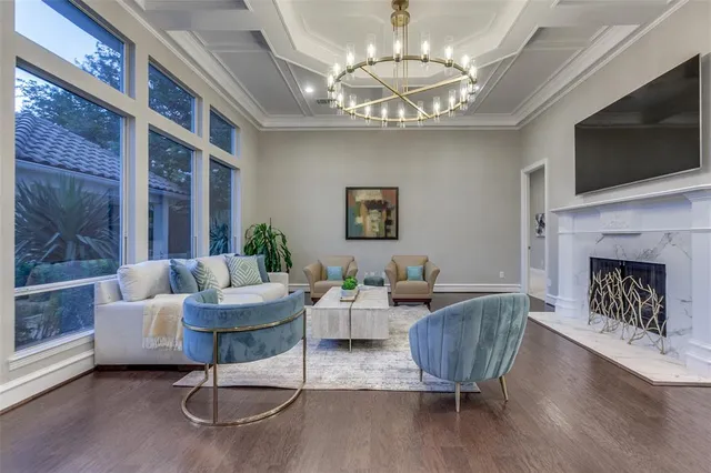 a living room with fireplace furniture and a flat screen tv