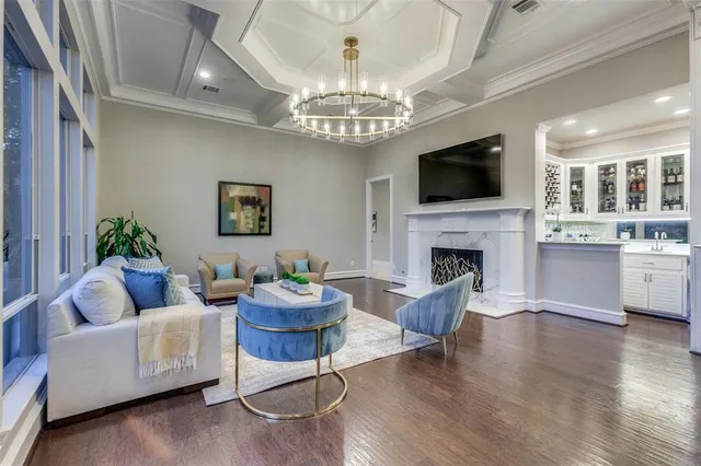 a kitchen with cabinets appliances a sink and a window