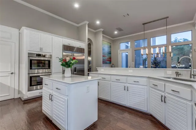 a bedroom with furniture and a large window
