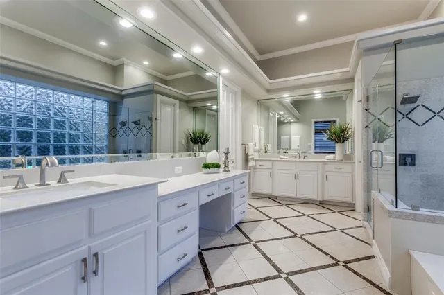 a bathroom with a tub a sink and a shower
