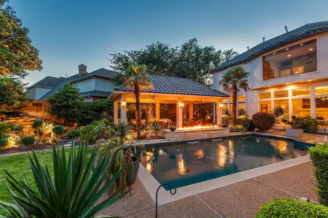 a view of a swimming pool with a patio