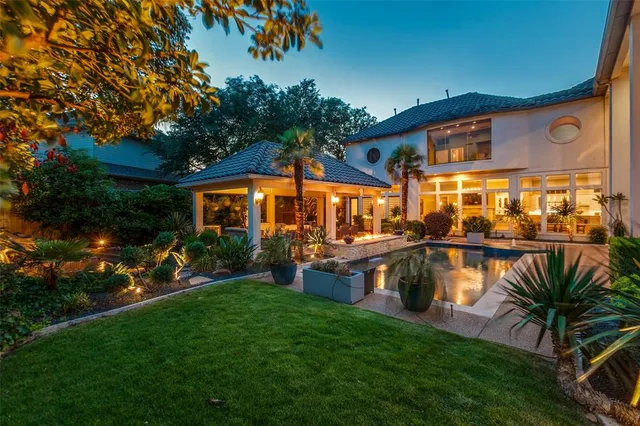 a view of a house with a yard porch and sitting area