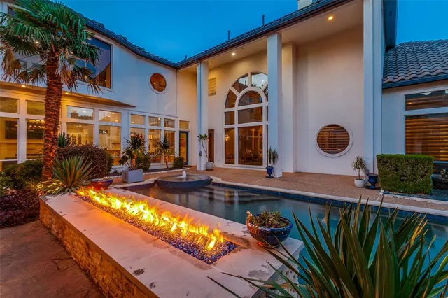 a view of swimming pool with a chairs