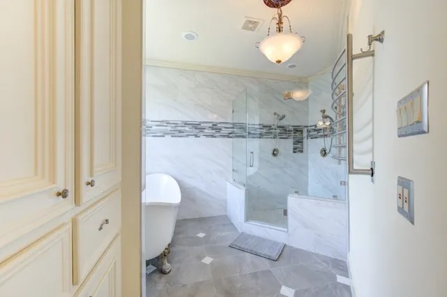 a bathroom with a sink a bathtub and window