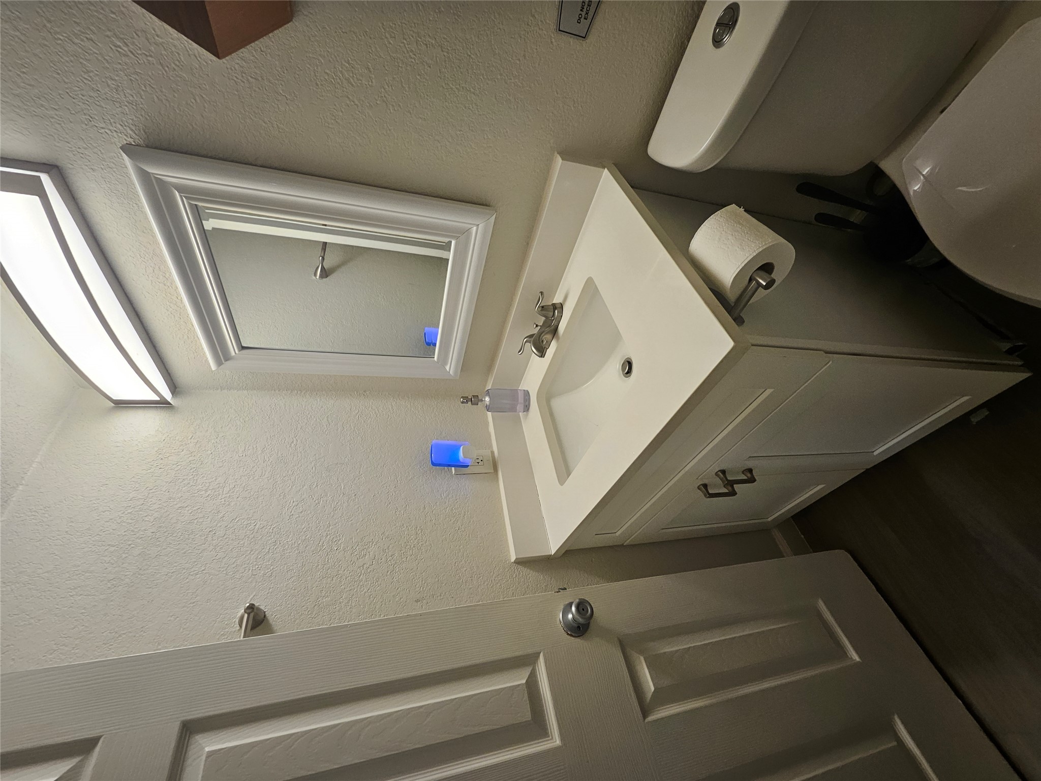4501 Speedway, Unit 104 Austin, TX 78751 - Photo 2 of 7 a bathroom with a sink toilet and mirror