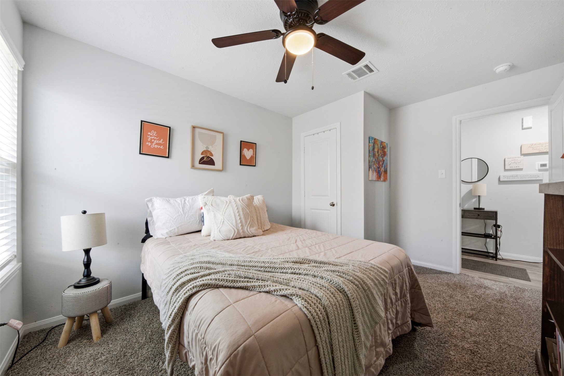 1523 22nd Street Hempstead, TX 77445 - Photo 15 of 26 Secondary bedroom with ceiling fan and versatile layout.