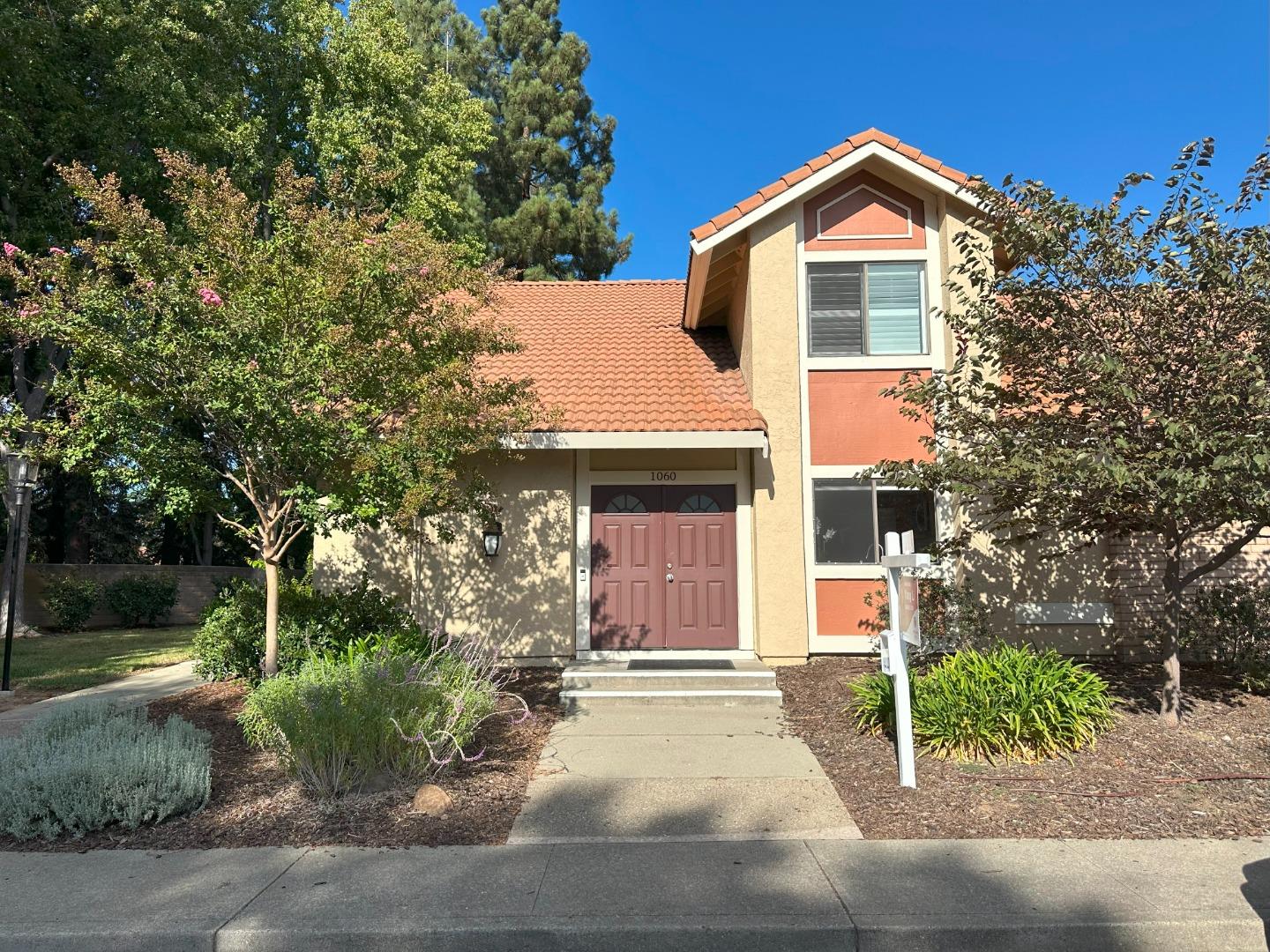 1060 Sheppard Road Walnut Creek, CA 94598 - Photo 1 of 1 a front view of a house with a yard and garage