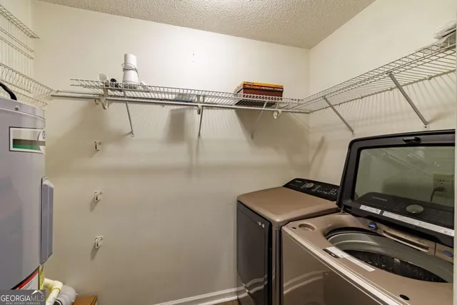 a view of storage and utility room with racks on the wall