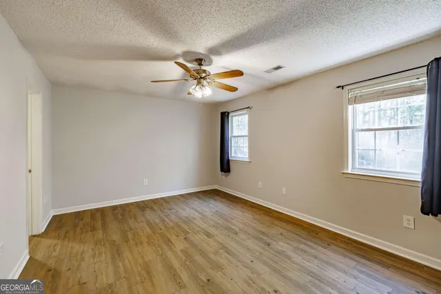 a view of entryway with wooden floor