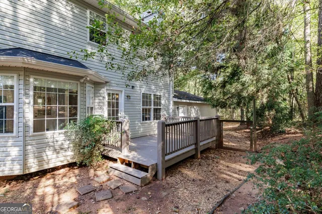 a view of a wooden deck with a backyard