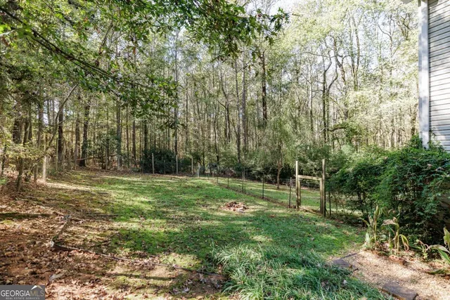 a view of outdoor space with trees all around