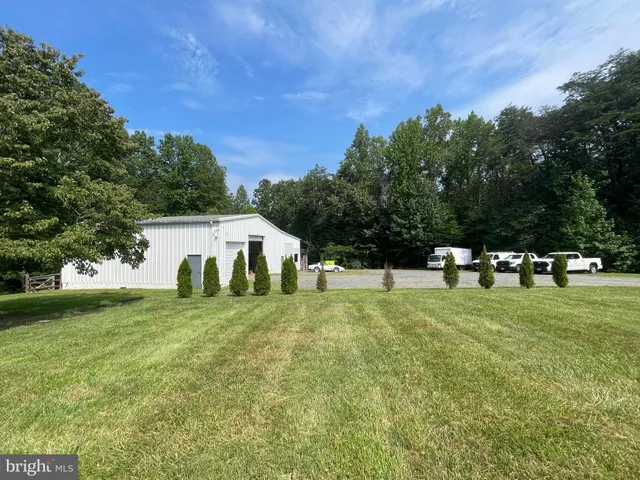 a bathroom with a double vanity sink and mirror