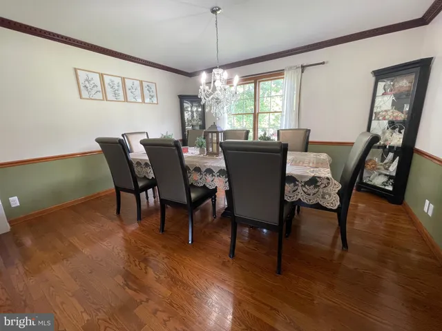 a view of a livingroom with furniture and a floor to ceiling window
