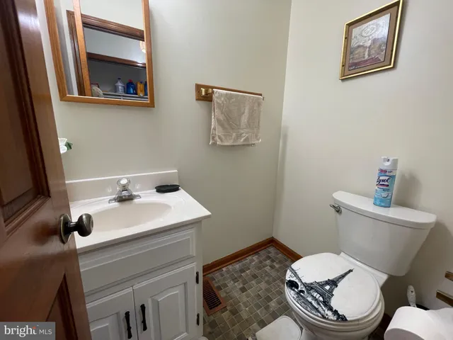 a view of backyard with deck and garden