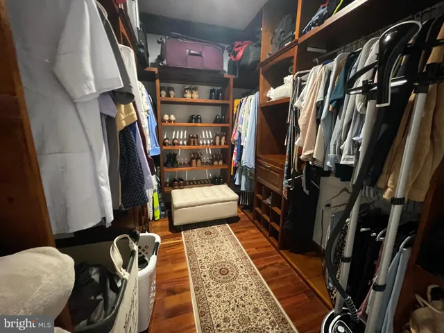 a view of a house with a backyard and a tree