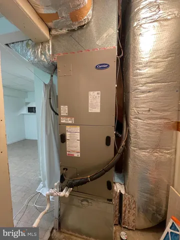 a kitchen with stainless steel appliances granite countertop a refrigerator and a stove