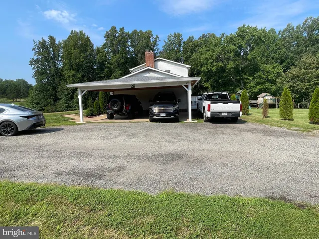 a white toilet sitting next to a shower
