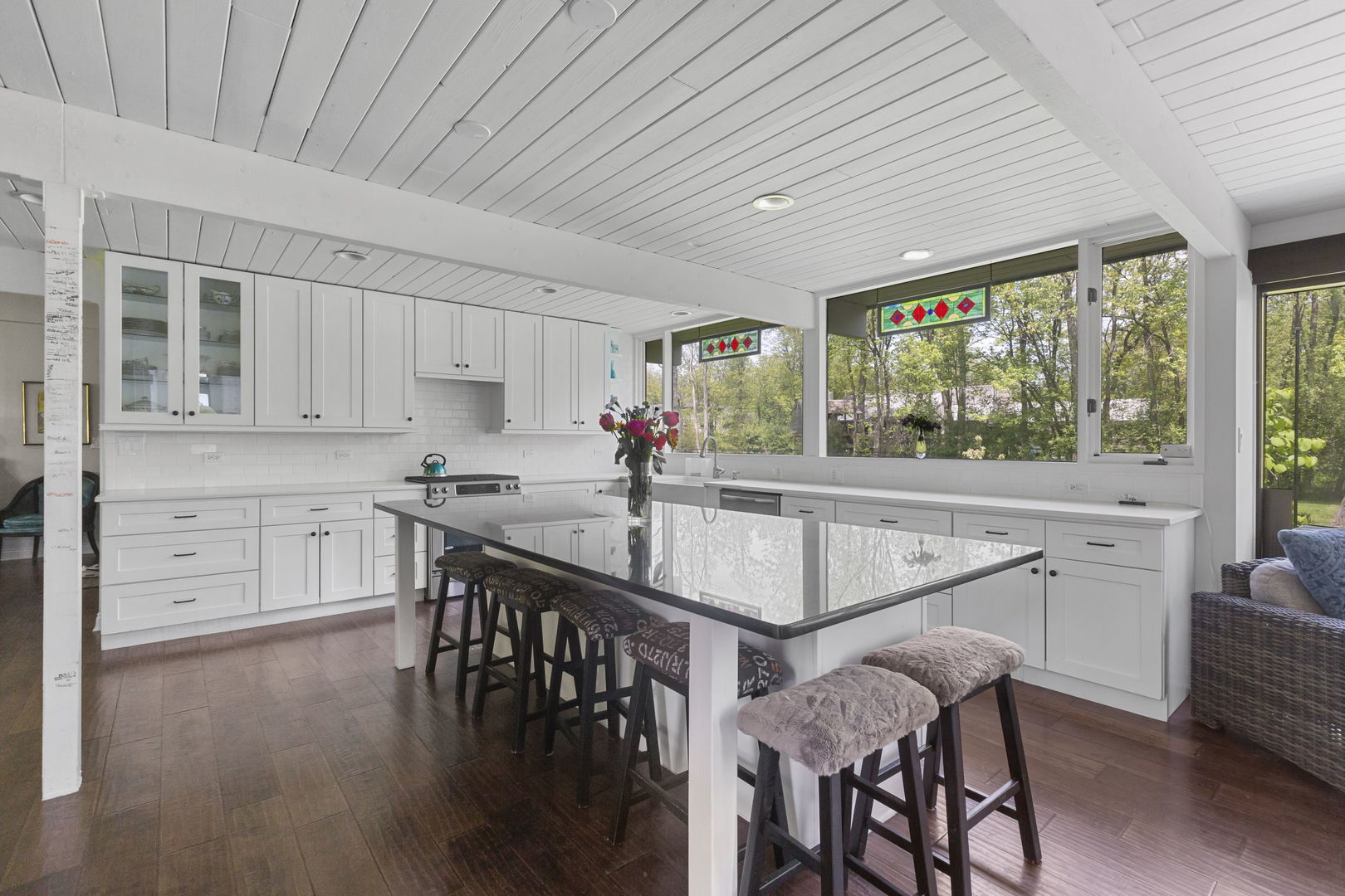 2440 West Course Drive Riverwoods, IL 60015 - Photo 3 of 19 a kitchen with stainless steel appliances granite countertop a stove a refrigerator a sink dishwasher and white cabinets with wooden floor