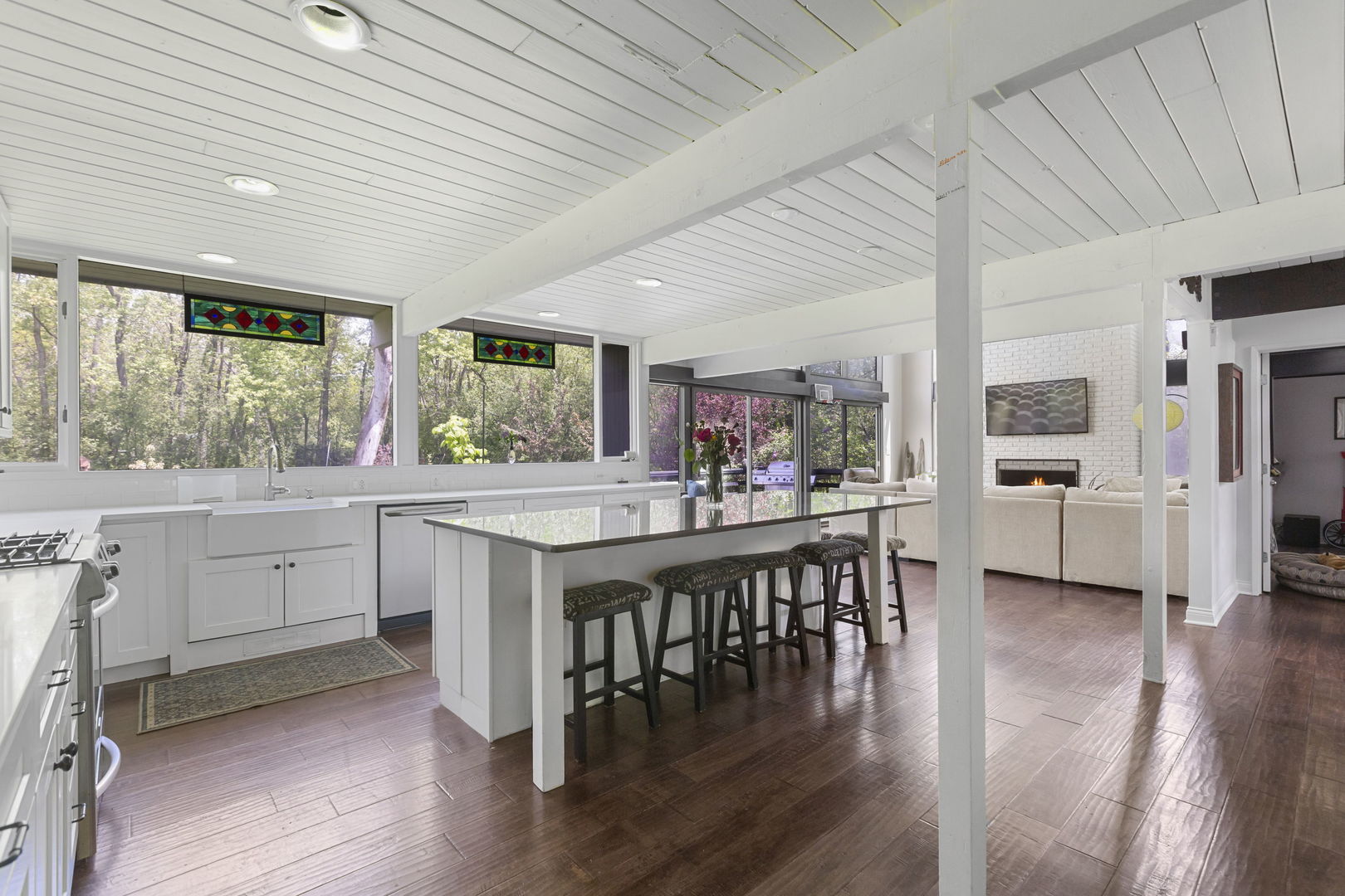 2440 West Course Drive Riverwoods, IL 60015 - Photo 5 of 19 a kitchen with stainless steel appliances granite countertop table chairs and wooden floor