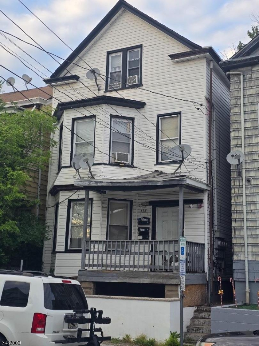 172 Jasper Street Paterson, NJ 07522 - Photo 1 of 1 a view of a house with a balcony
