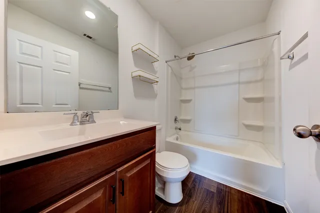 a bathroom with a sink a toilet and a bathtub