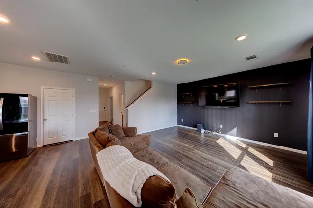 a room with furniture and a flat screen tv