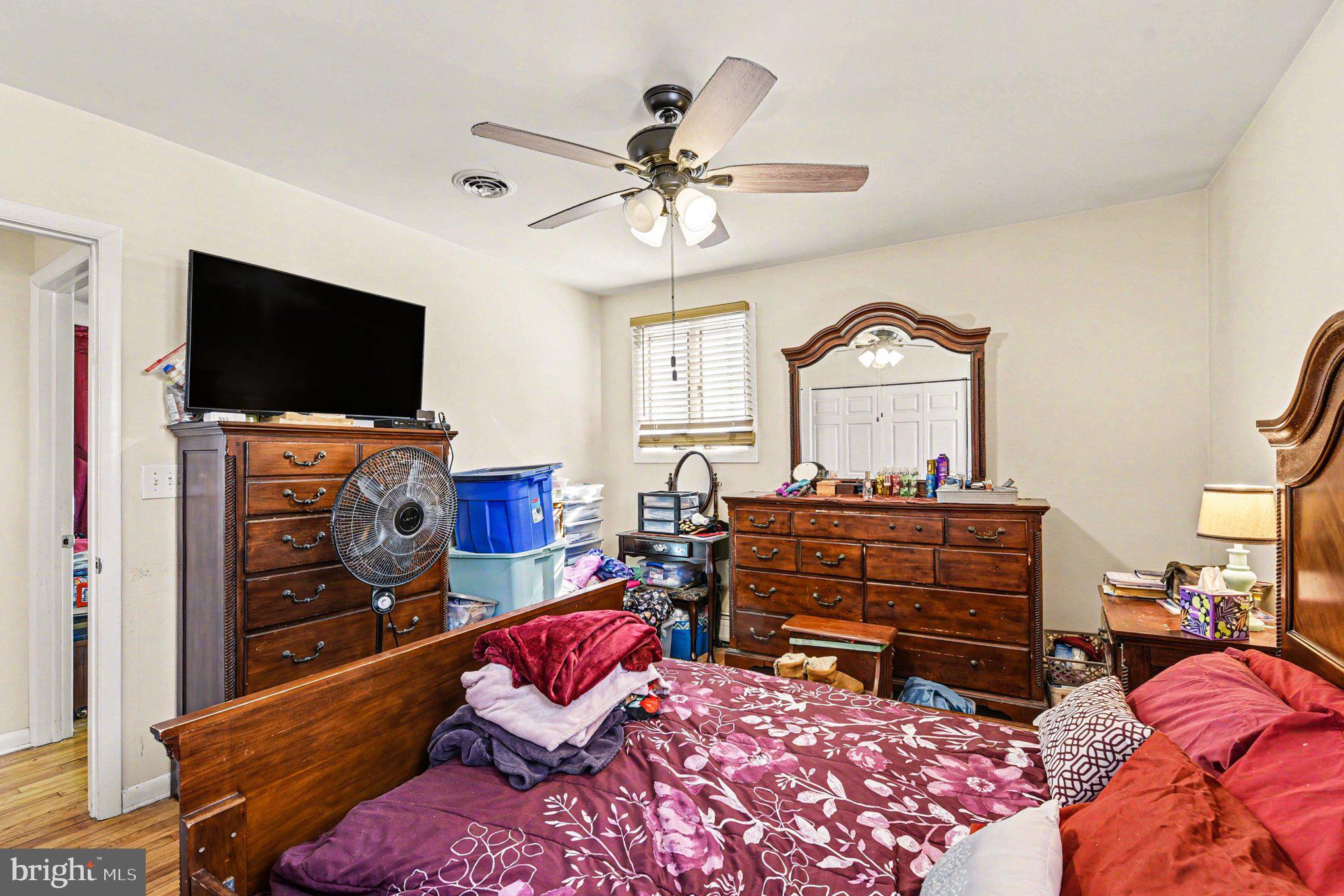 677 Dr Miller Road North East, MD 21901 - Photo 13 of 28 a bedroom with furniture and a flat screen tv