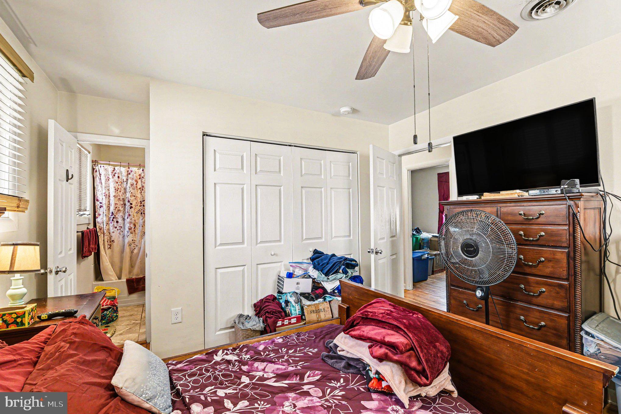 677 Dr Miller Road North East, MD 21901 - Photo 14 of 28 a bedroom with bed and flat tv screen on the dresser