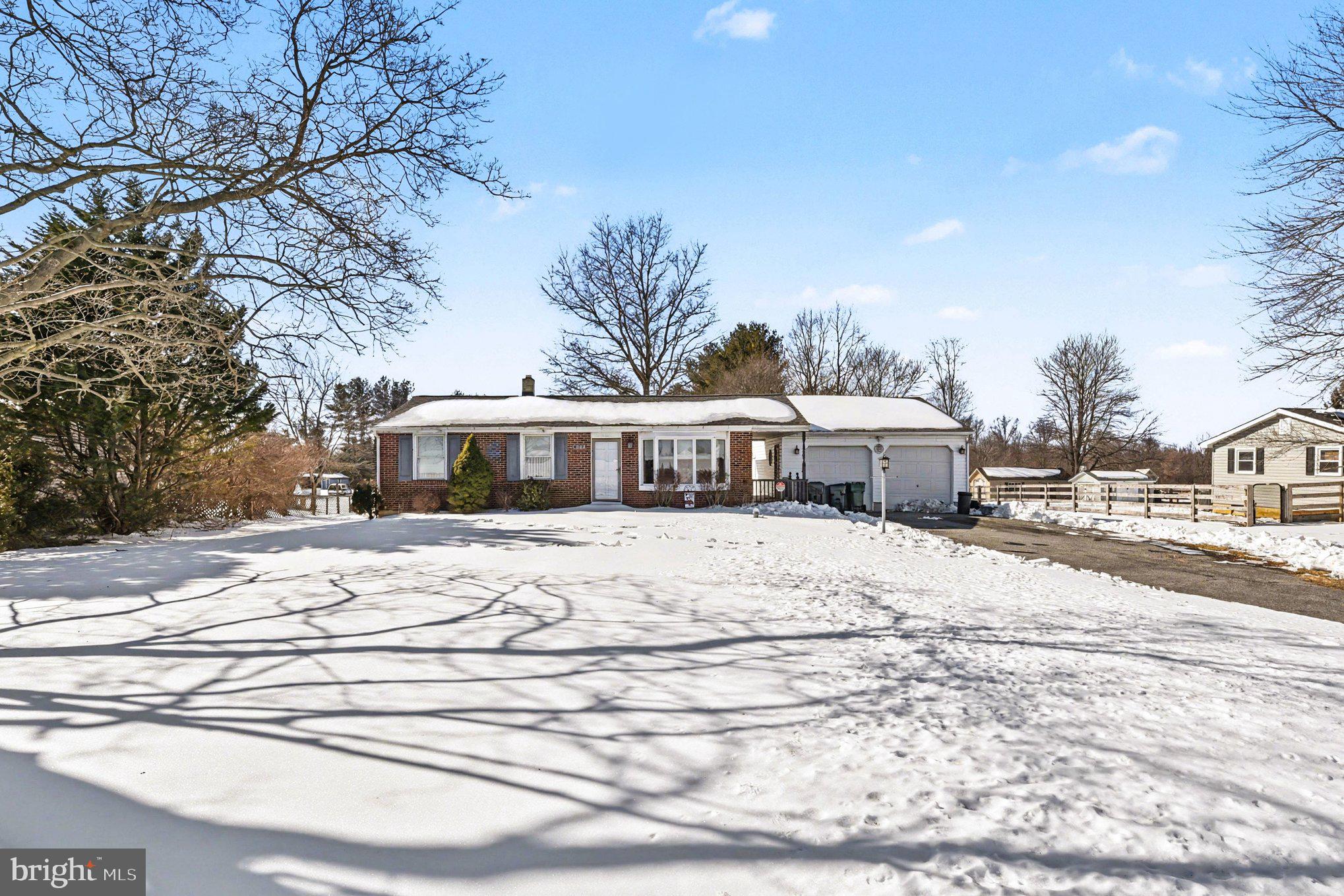 677 Dr Miller Road North East, MD 21901 - Photo 2 of 28 a double white house with a yard and wooden fence