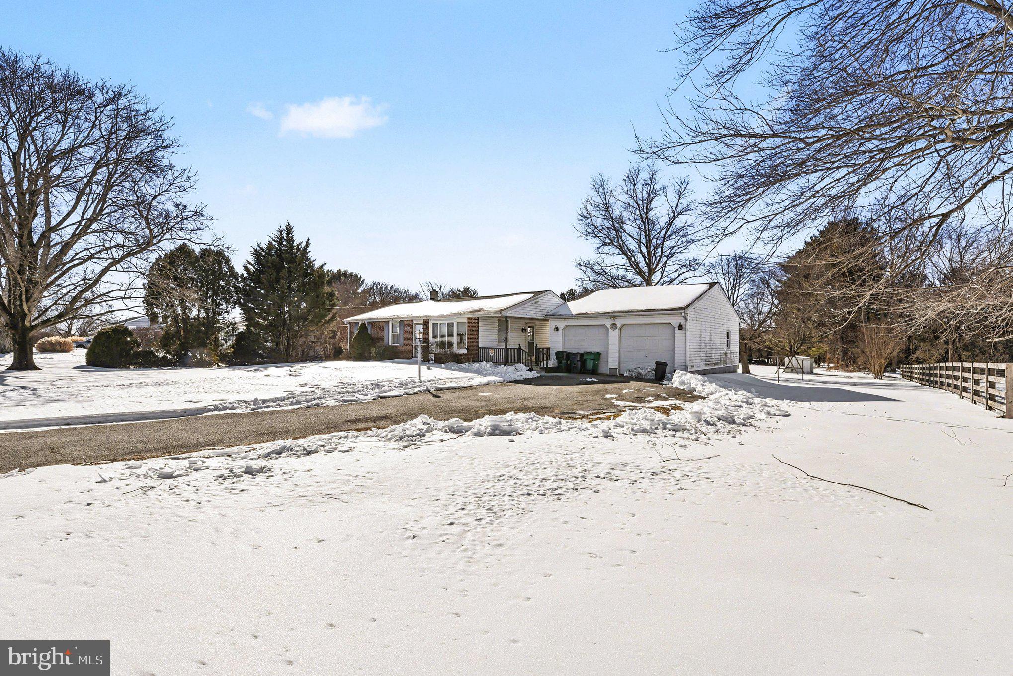 677 Dr Miller Road North East, MD 21901 - Photo 4 of 28 a view of a house with a yard covered in snow