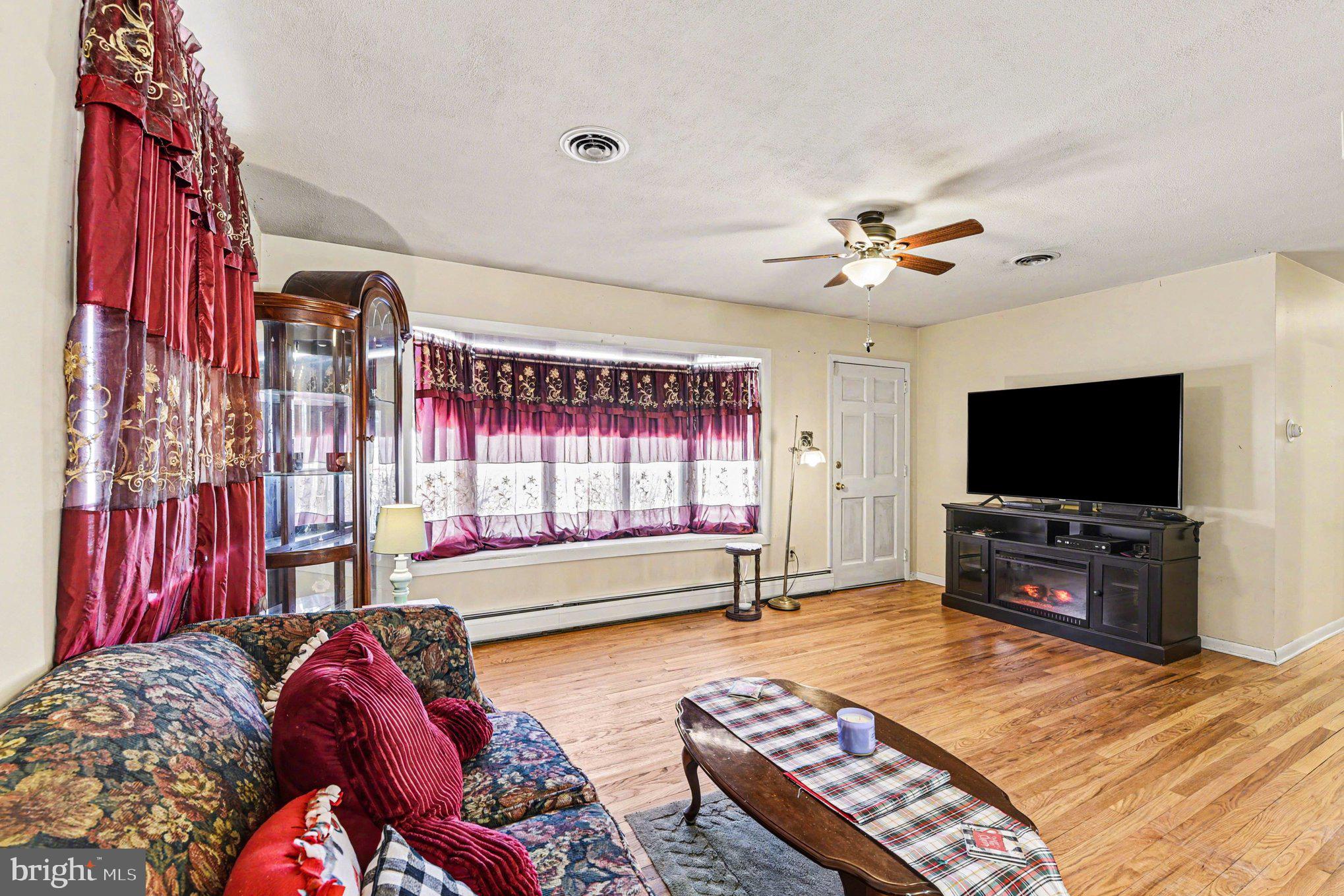 677 Dr Miller Road North East, MD 21901 - Photo 5 of 28 a living room with furniture and a flat screen tv
