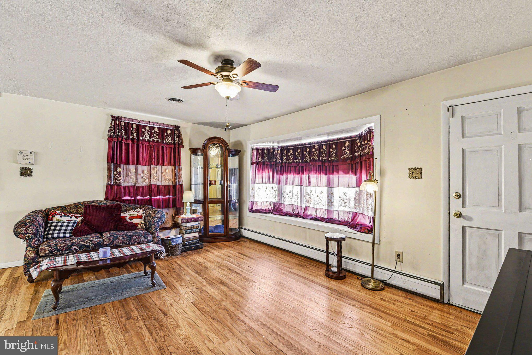 677 Dr Miller Road North East, MD 21901 - Photo 6 of 28 a living room with furniture window and wooden floor